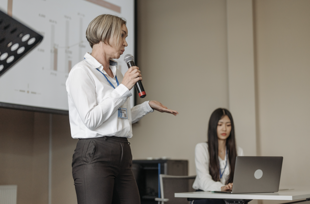 Woman speaking with microphone 